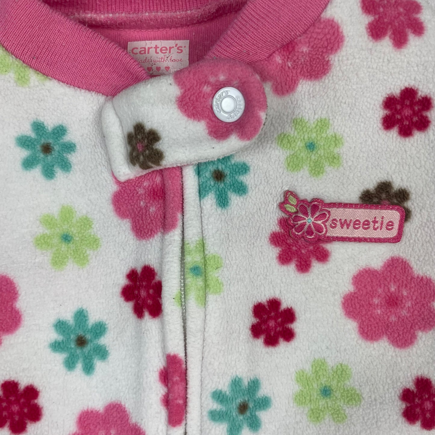 Rosa Polyester Overall mit farbenfrohem Blumenmuster und Fuß – detail