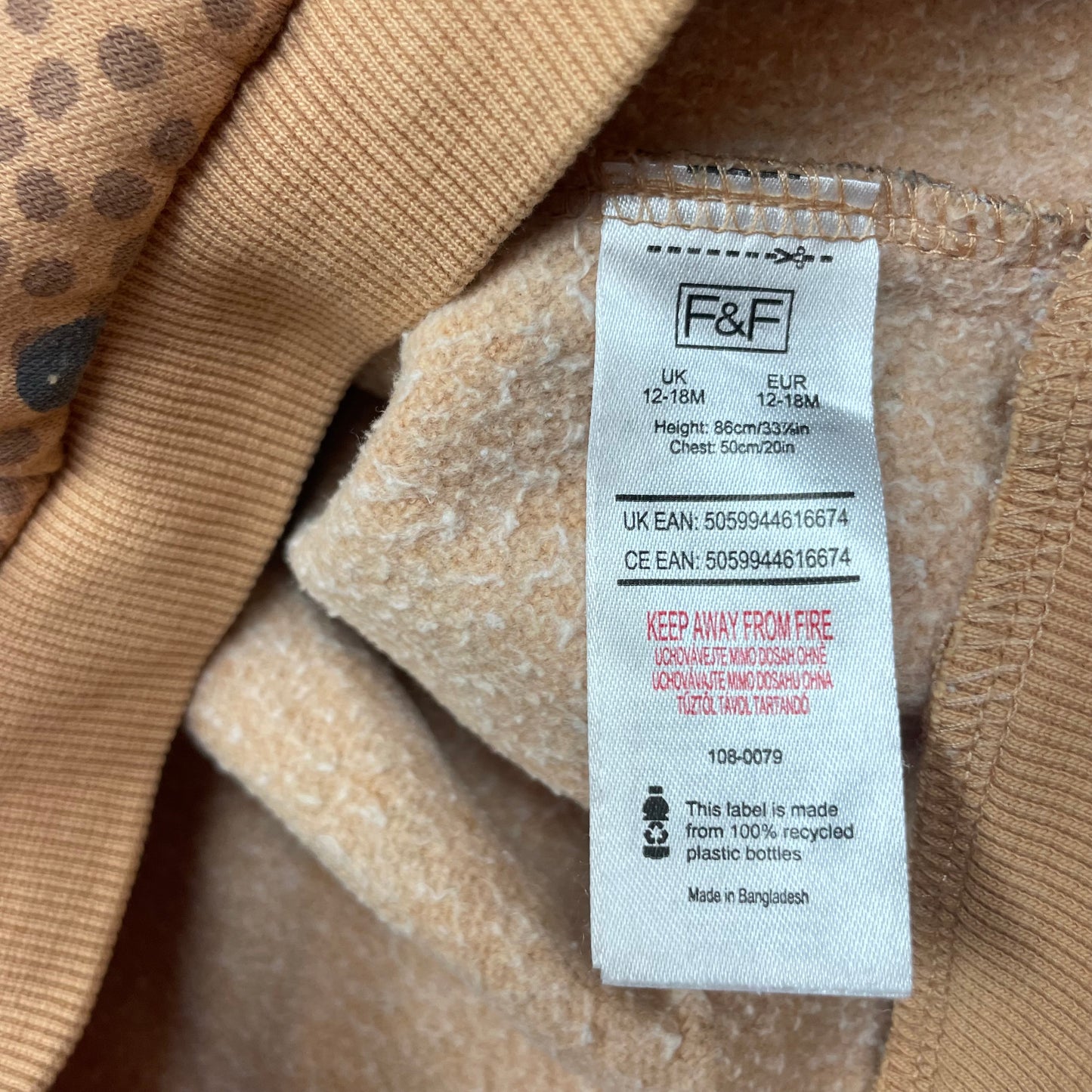 Brauner Pullover mit schwarzem Blumenmuster für Babys – label