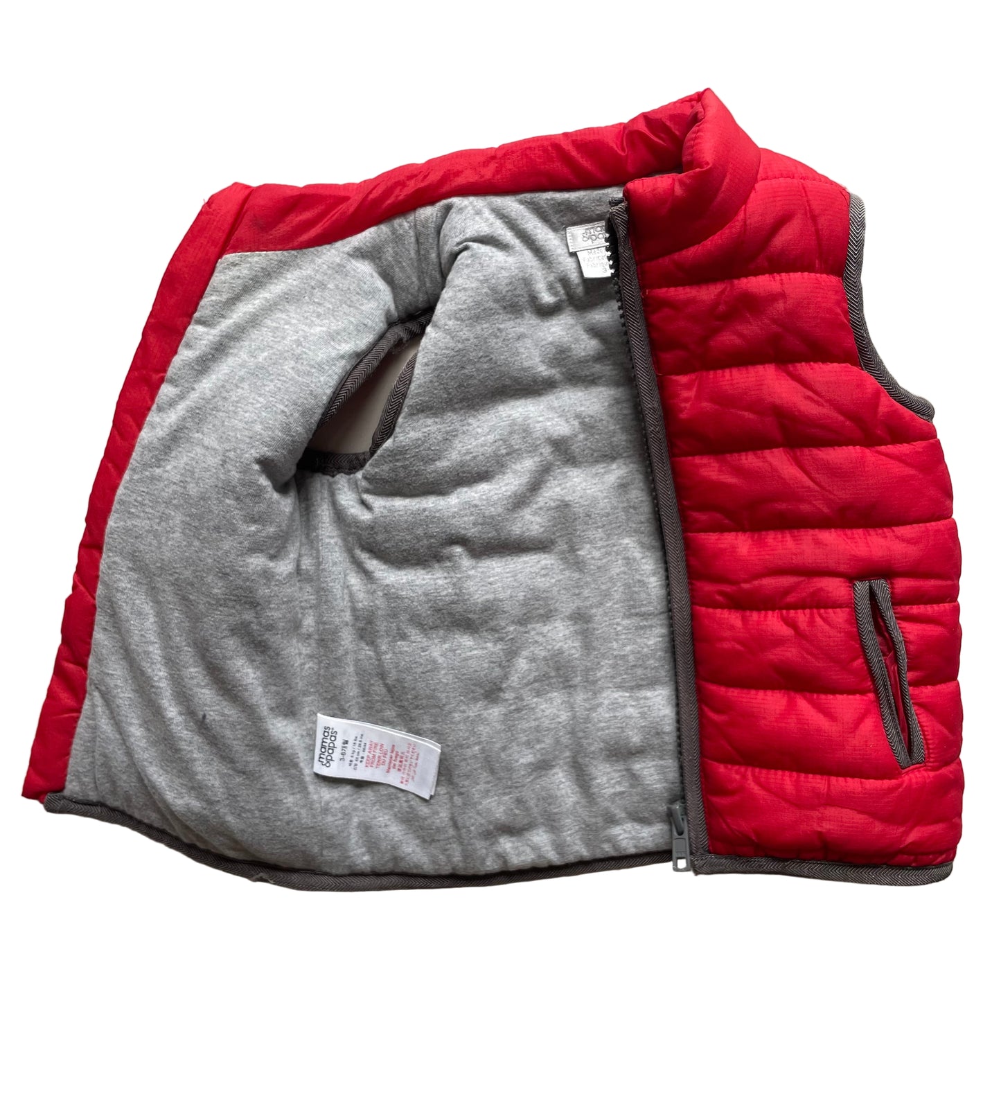 Rote gesteppte Kinderweste mit Reißverschluss und grauen Kanten – inside