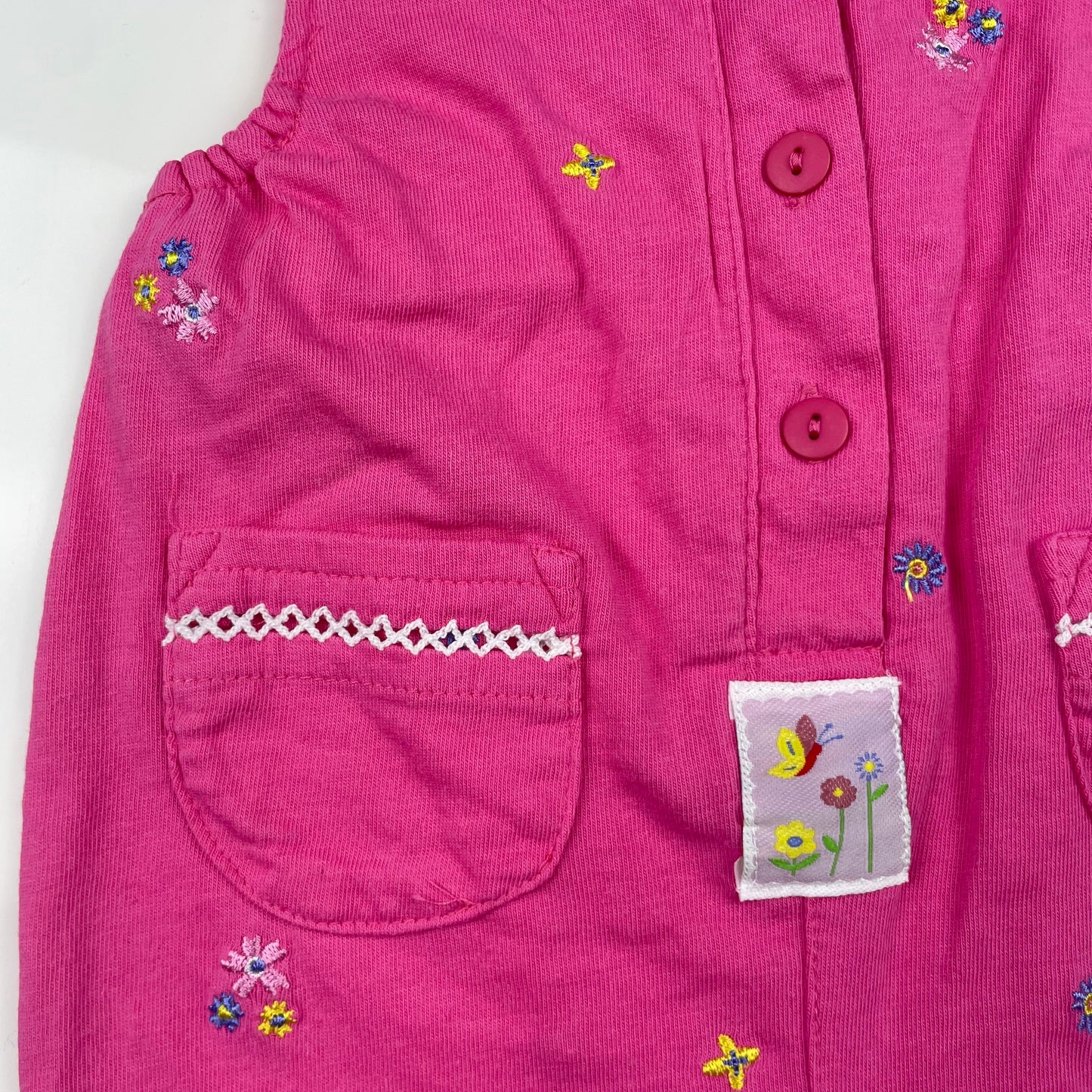 Rosa Baumwoll-Overall mit Blumenstickerei für Babys – detail