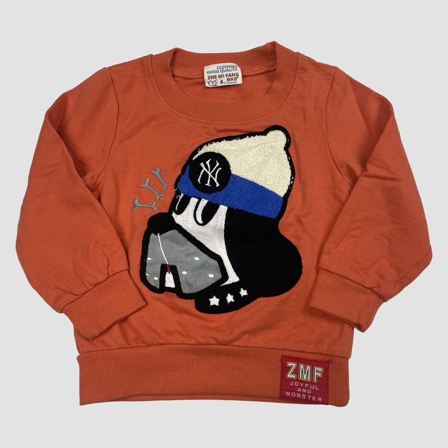 Oranger Kinderpullover mit Hund-Applikation von Zhe Mi Fang in Größe 110 – front