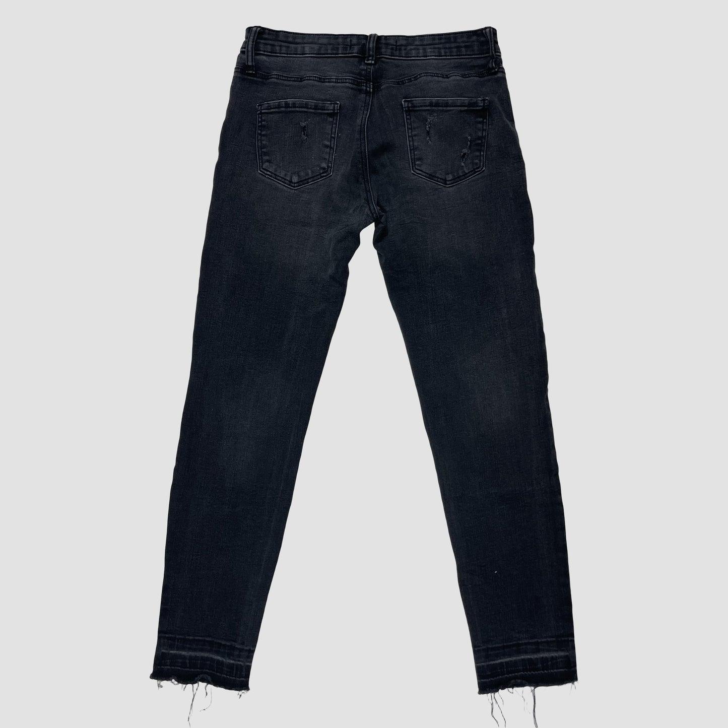 Schwarze Skinny-Jeans aus Denim mit Rissen und Fransensaum