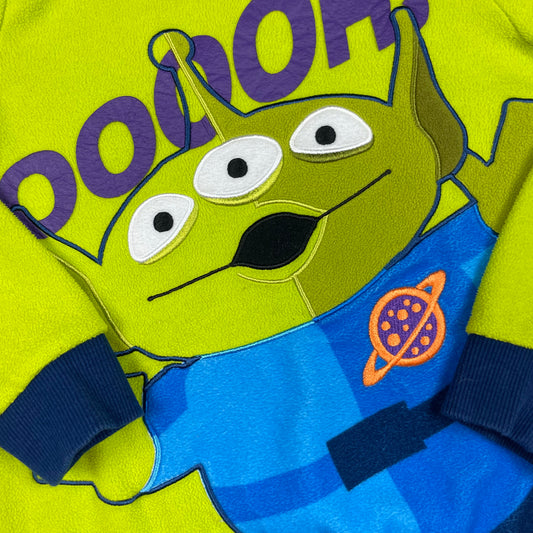 Grüner Kinderpullover mit Toy-Story-Alien-Print und dunkelblauen Bündchen, Größe ca. 116. – detail