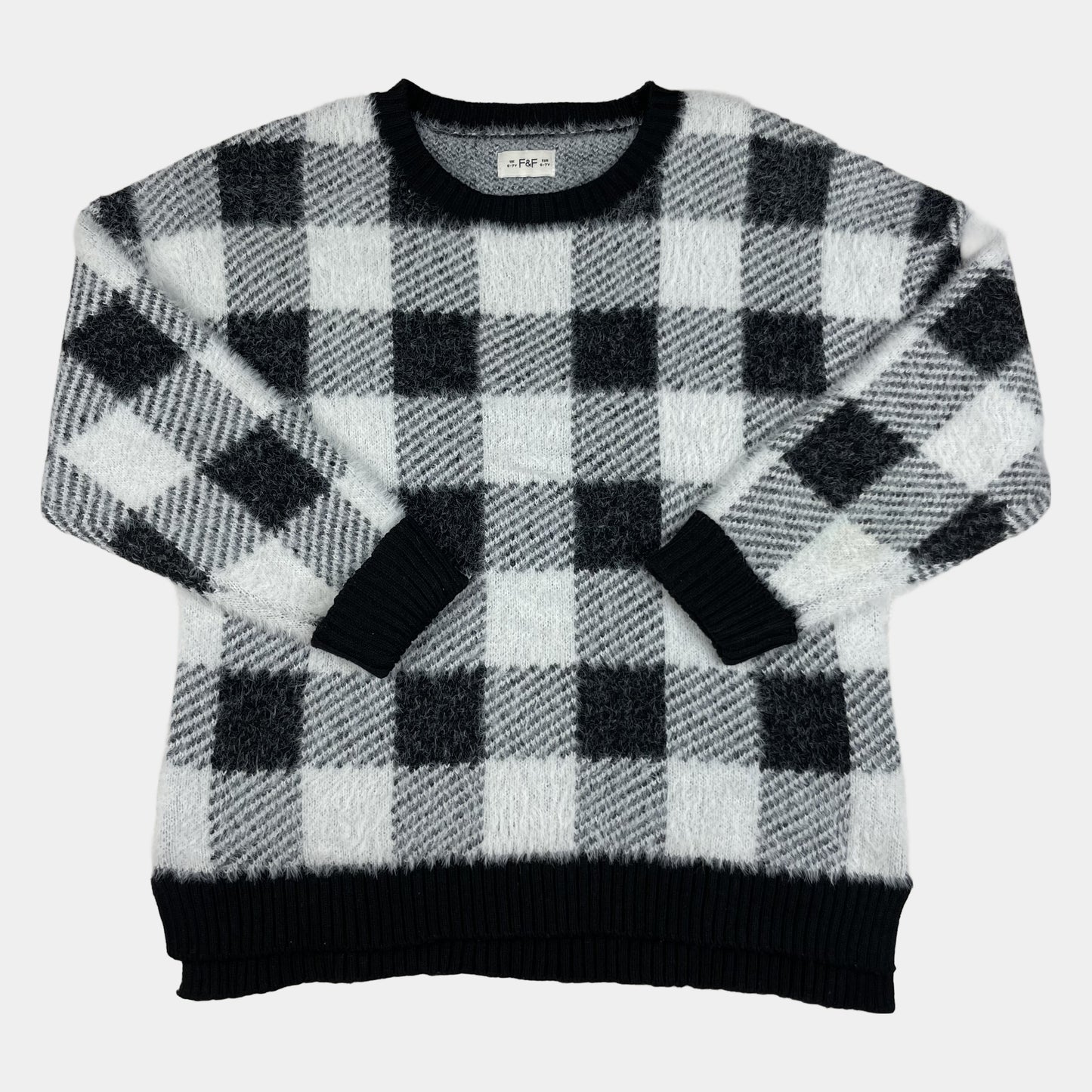 Flauschiger Kinderpullover mit schwarz-weißem Karomuster, Rundhals und Rippbündchen – front
