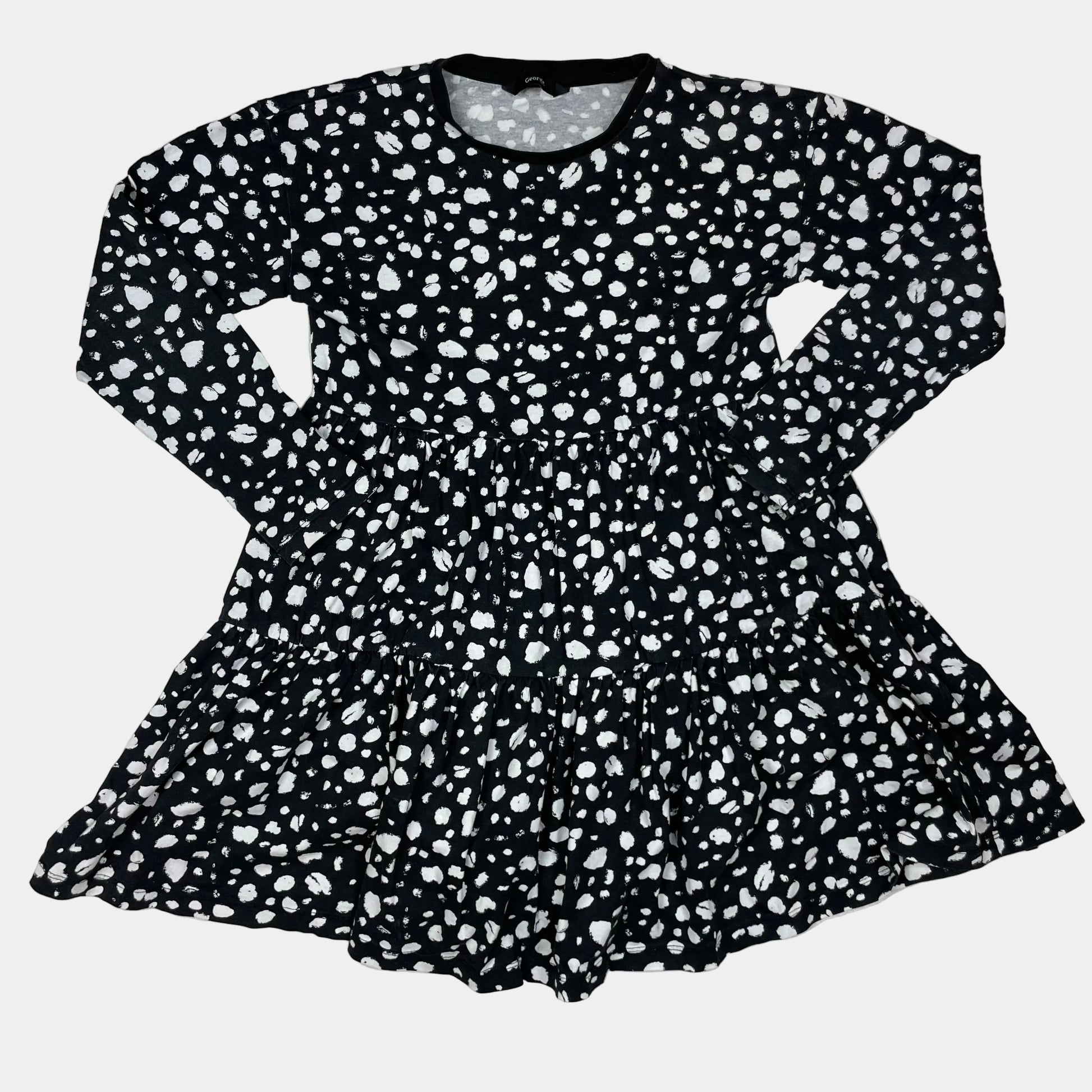 Schwarzes Baumwollkleid mit gepunktetem Muster und langen Ärmeln