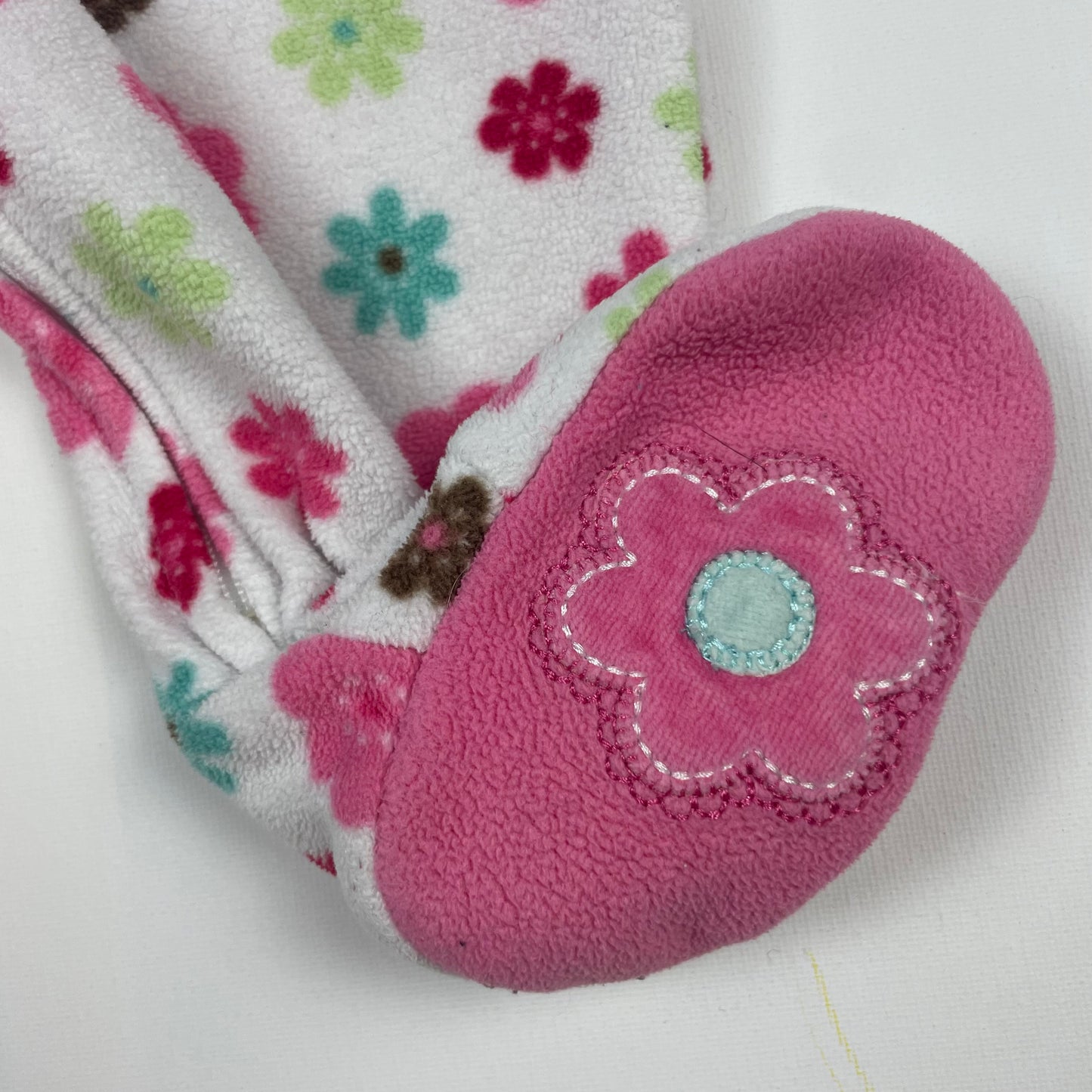 Rosa Polyester Overall mit farbenfrohem Blumenmuster und Fuß – sleeve