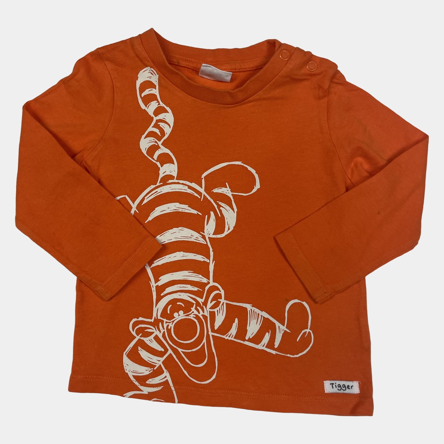Oranges Langarmshirt mit Tigger-Motiv, geeignet für 9-12 Monate alte Kinder. – front