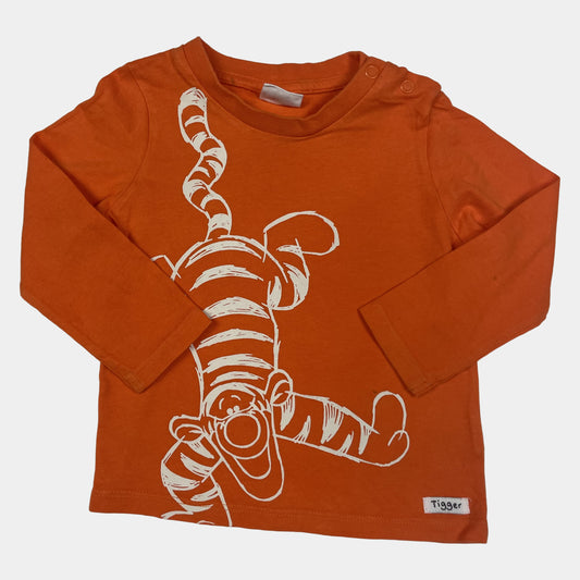 Oranges Langarmshirt mit Tigger-Motiv, geeignet für 9-12 Monate alte Kinder. – front
