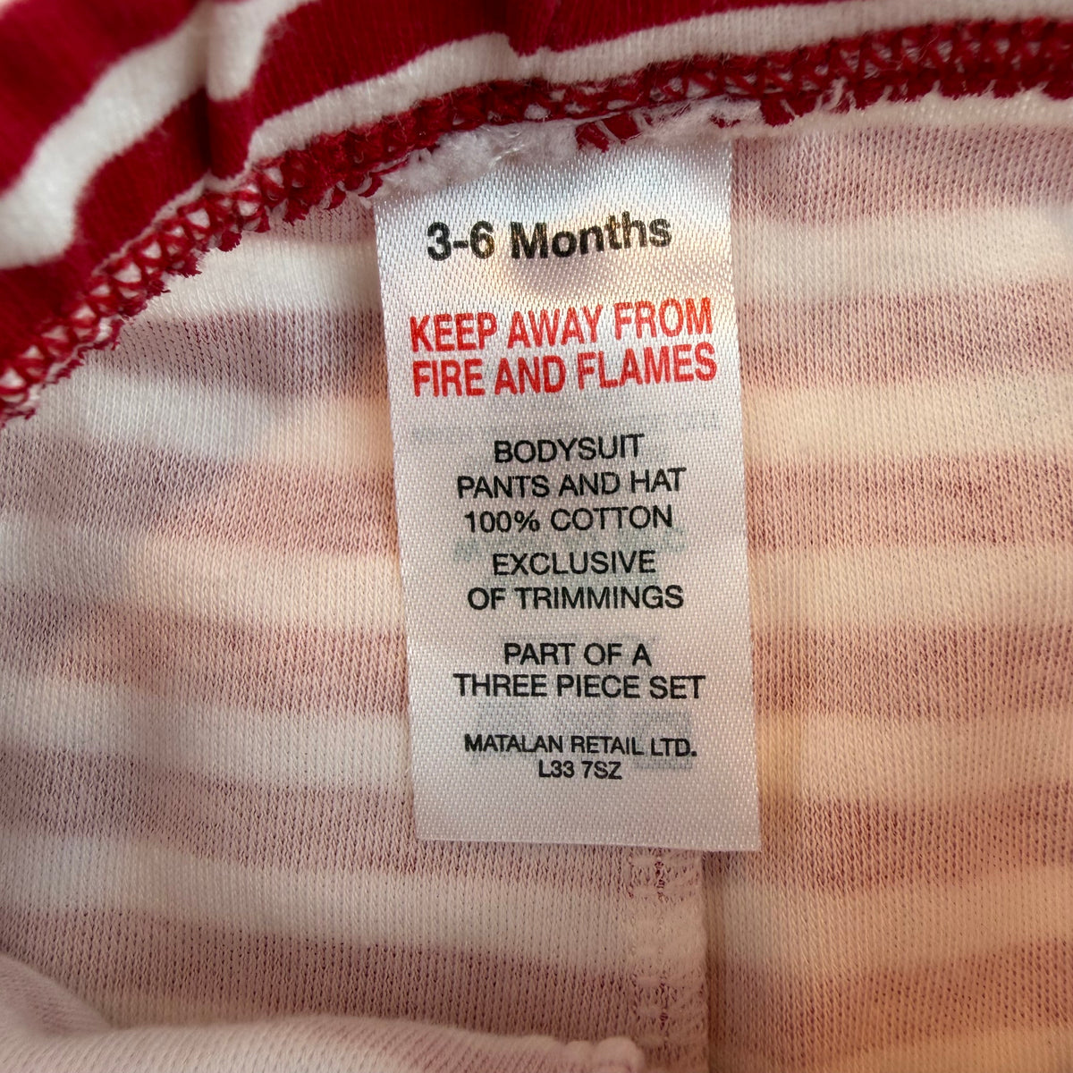 Rot-weiße gestreifte Babyhose mit elastischem Bund – label