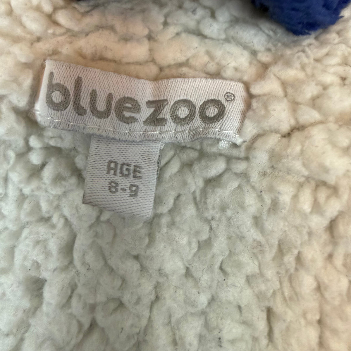 Dunkelblauer Kinder-Bademantel aus Fleece mit Kapuze, Einhorn- und Sternemuster, Bindegürtel und Taschen – label
