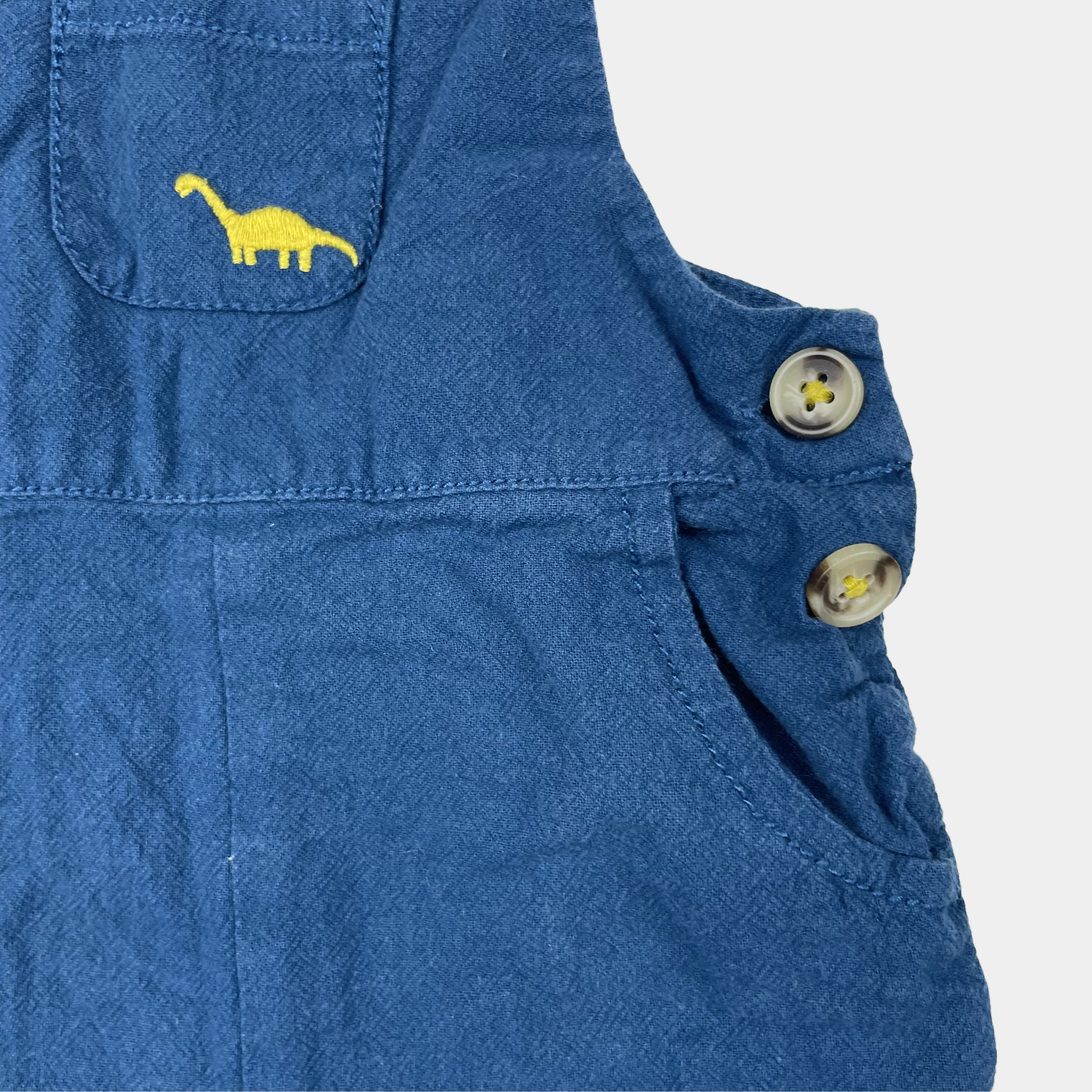 Blauer Overall mit Dinosaurier-Stickerei und Knöpfen – detail