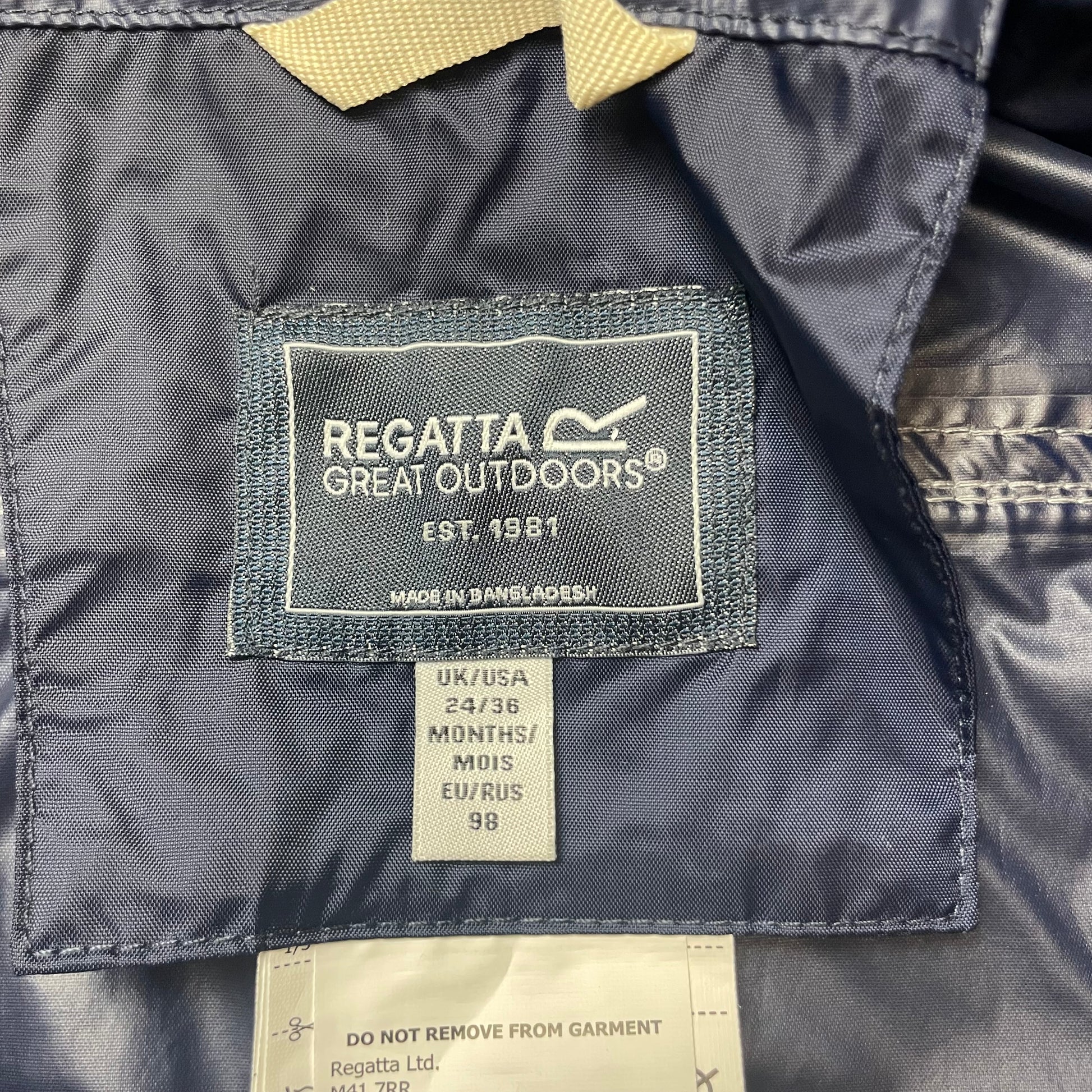 Dunkelblauer wasserdichter Overall für Kinder mit Kapuze von Regatta – label