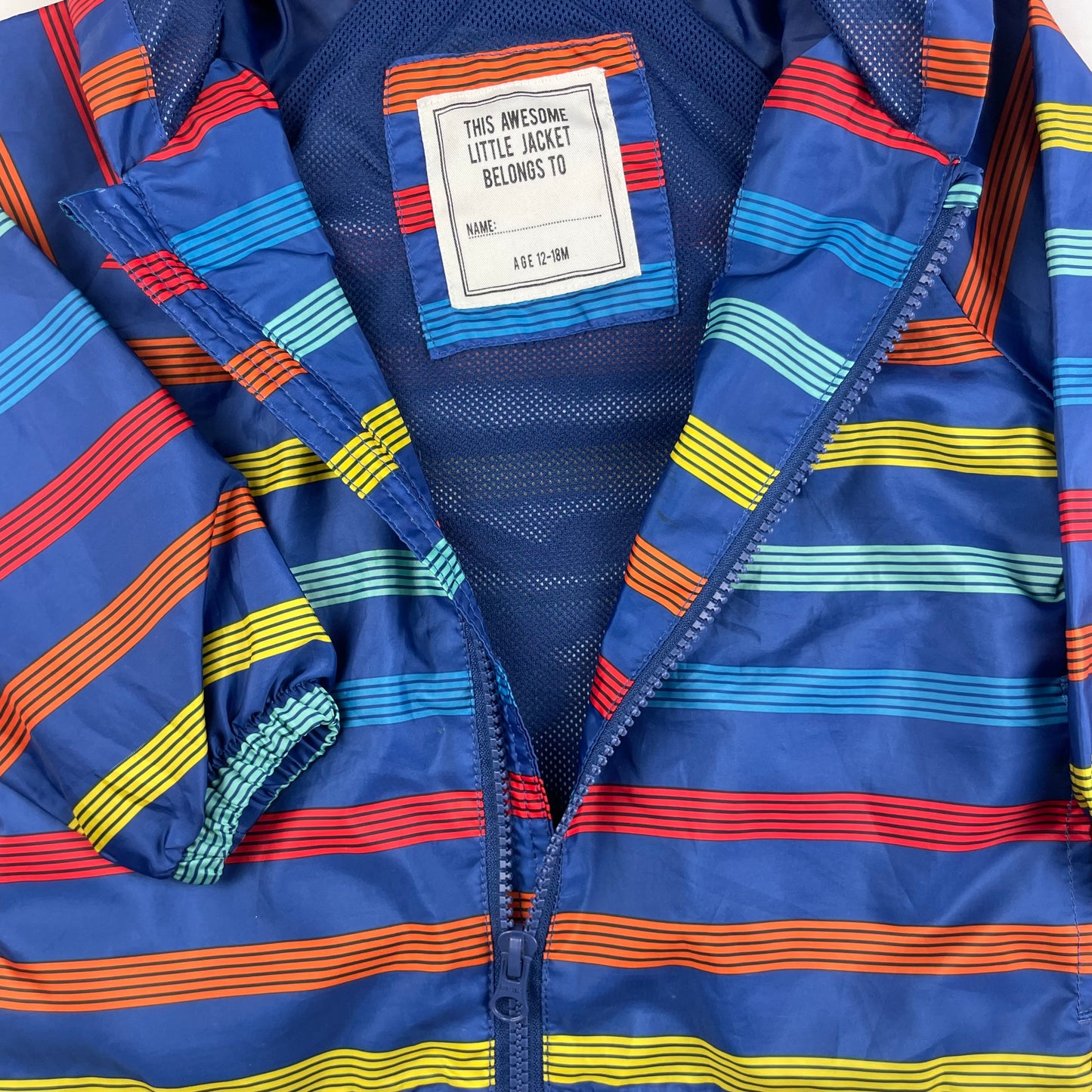 Bunte Regenjacke mit Kapuze für Kinder 12-18 Monate – detail