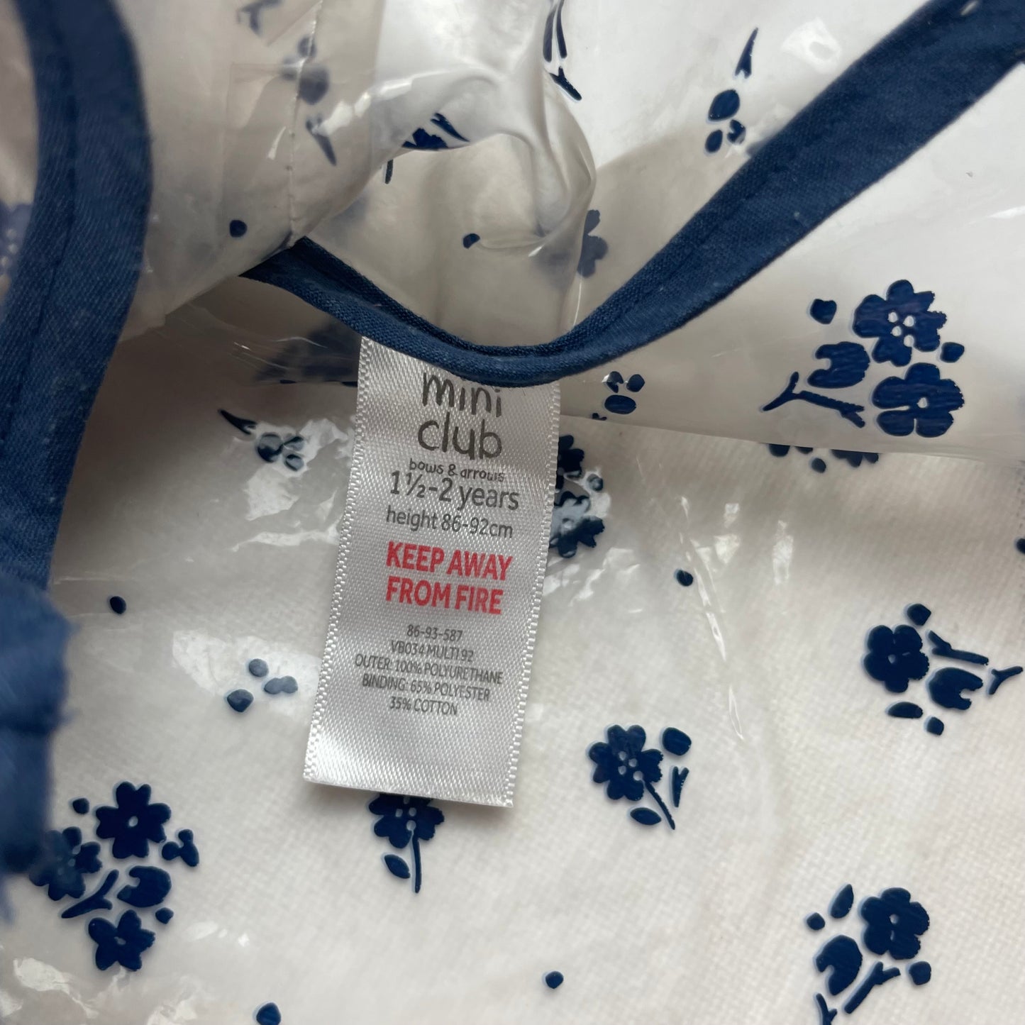 Transparente Regenjacke mit dunkelblauem Blumenmuster für Kinder – label