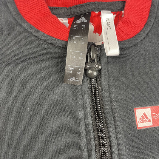 Schwarze Jacke mit roten Akzenten und Disney-Logo – detail