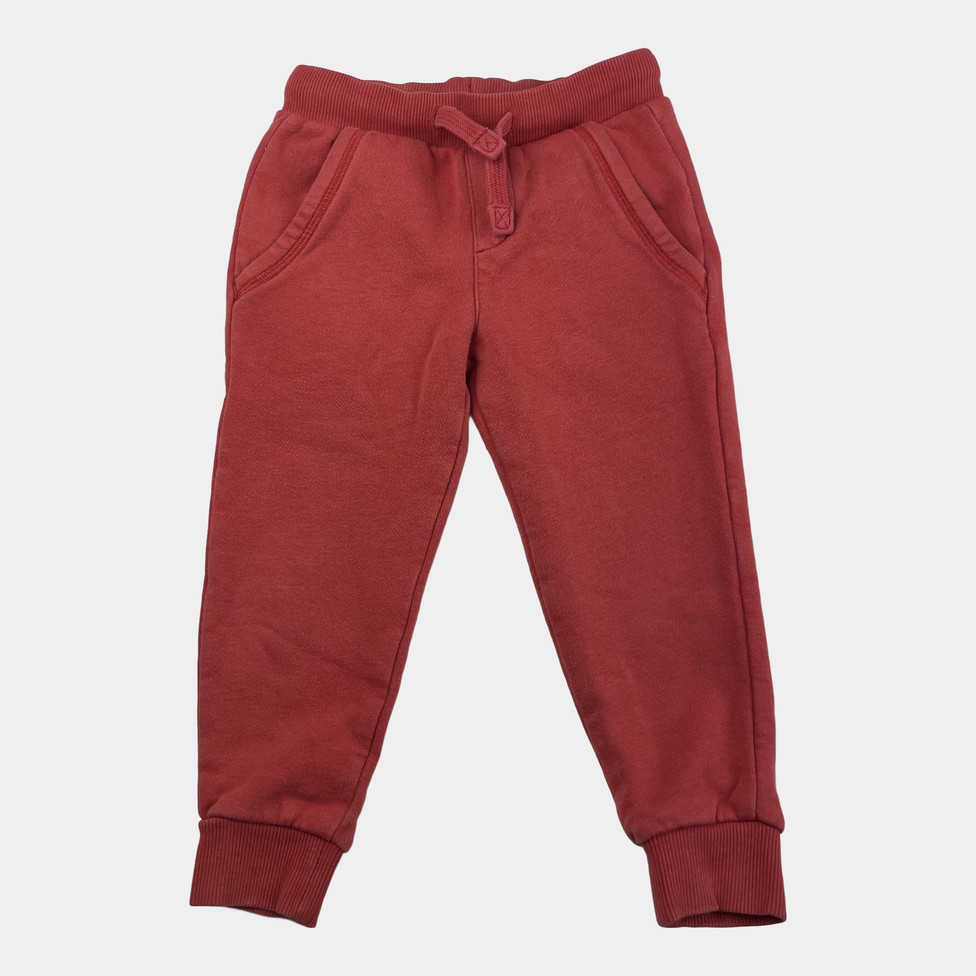 Rote Baumwoll-Jogginghose mit elastischem Bund und Seitentaschen. – front